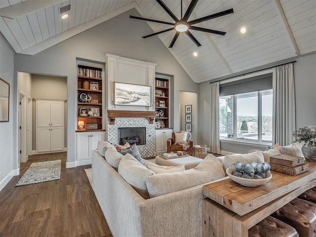 living area featuring a ceiling fan, a fireplace, dark wood finished floors, high vaulted ceiling, and recessed lighting