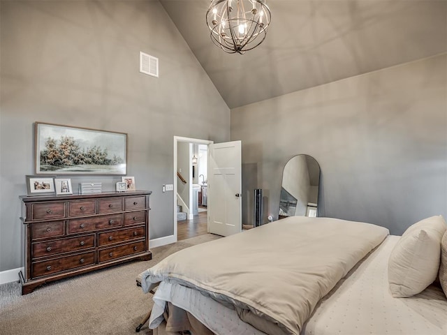 bedroom featuring visible vents, high vaulted ceiling, baseboards, carpet floors, and a notable chandelier