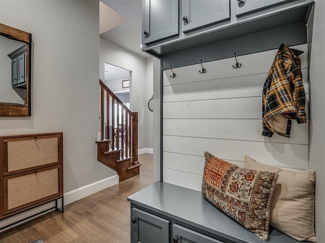 mudroom with light wood-style floors and baseboards