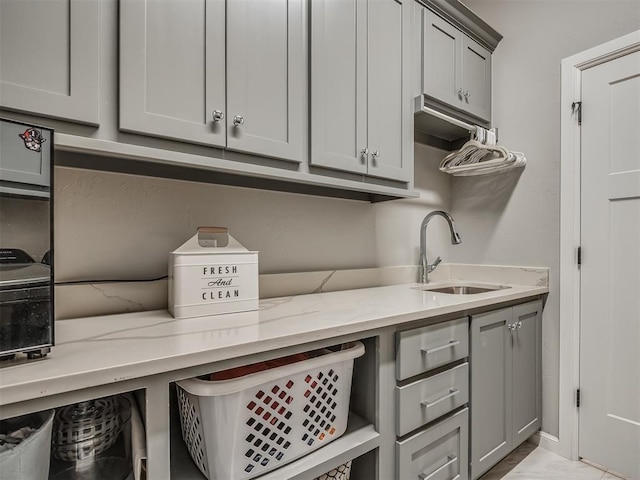 laundry area with a sink