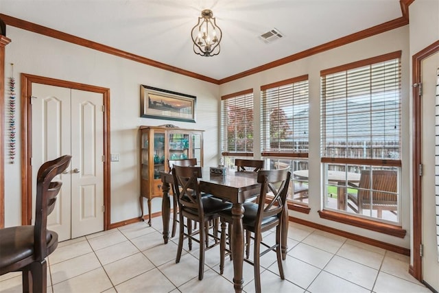 116 Mission Hills Dr, Guthrie, OK 73044 - dining area featuring crown molding, light tile patterned floors, and baseboards