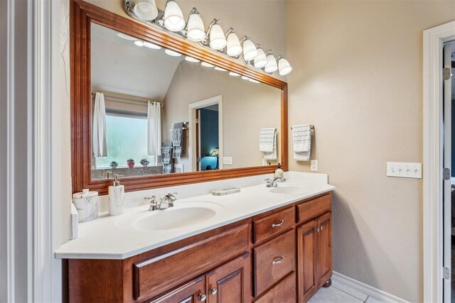 116 Mission Hills Dr, Guthrie, OK 73044 - full bathroom featuring double vanity, ensuite bathroom, lofted ceiling, and tile patterned floors
