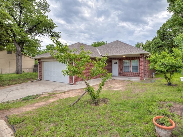 ranch-style home featuring a garage, brick siding, fence, a front lawn, and concrete driveway