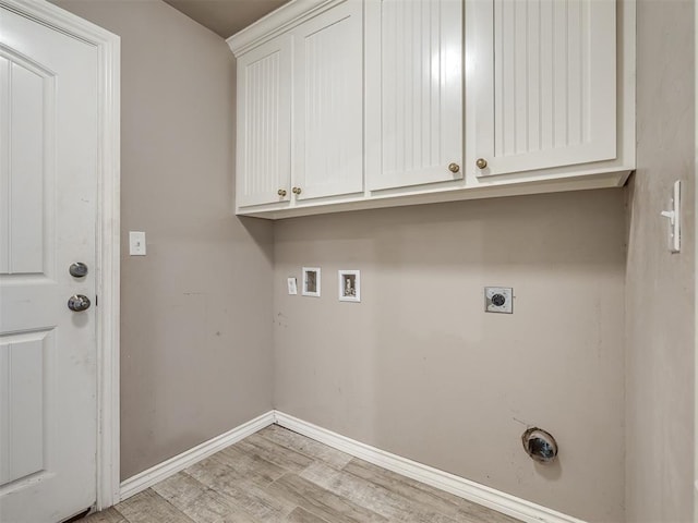 laundry area featuring cabinet space, hookup for a washing machine, light wood-style flooring, electric dryer hookup, and baseboards
