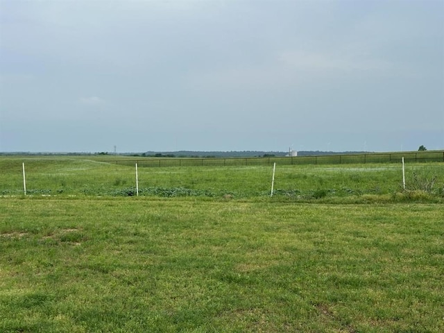 view of yard with a rural view