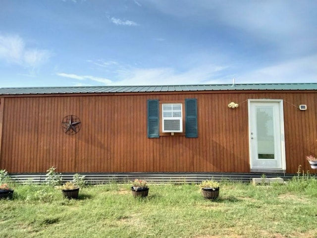 exterior space with metal roof