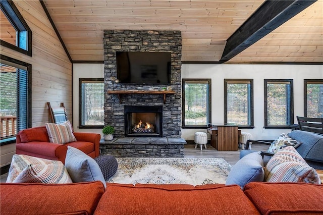living room with lofted ceiling, wood ceiling, wood walls, wood finished floors, and a fireplace
