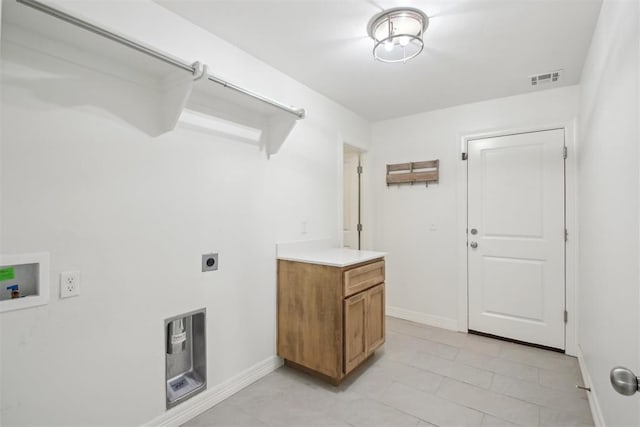 clothes washing area with laundry area, electric dryer hookup, visible vents, baseboards, and hookup for a washing machine