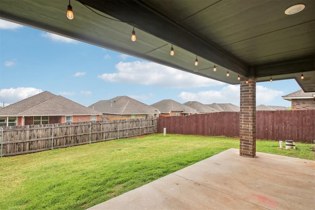 view of yard with a fenced backyard and a patio area