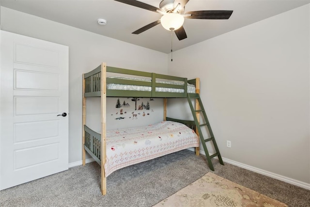 carpeted bedroom with baseboards and ceiling fan