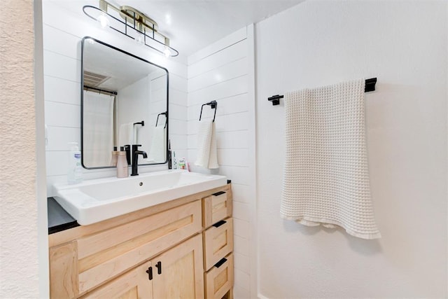 full bath featuring vanity and visible vents