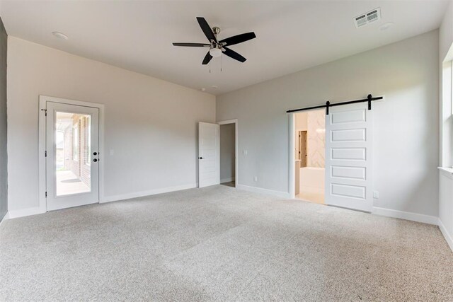 unfurnished bedroom featuring visible vents, carpet flooring, and access to outside