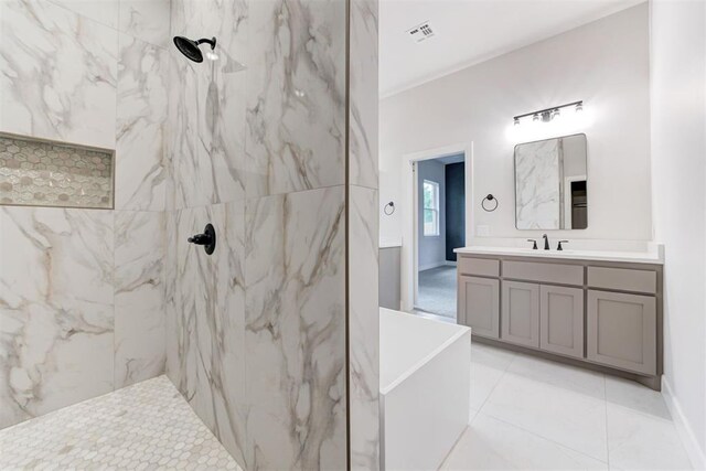 full bath featuring tile patterned floors, visible vents, a marble finish shower, and vanity