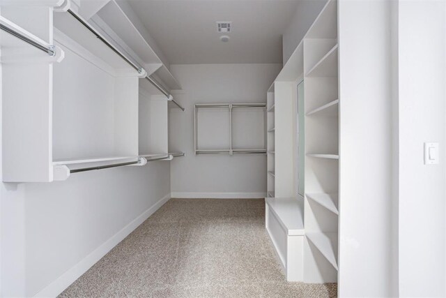 spacious closet featuring carpet floors and visible vents