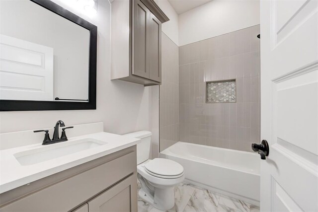 full bath with vanity, toilet, bathing tub / shower combination, and marble finish floor