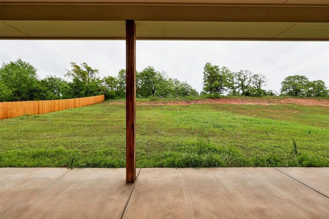 view of yard with fence and a patio area