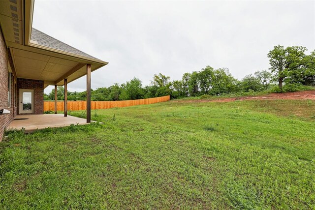view of yard with a patio area and fence
