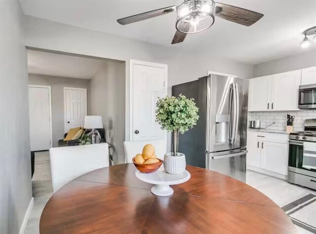 dining area featuring ceiling fan