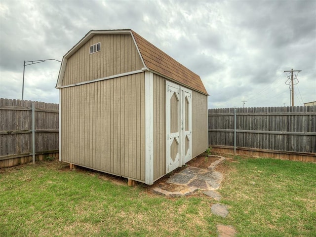 view of shed with a fenced backyard