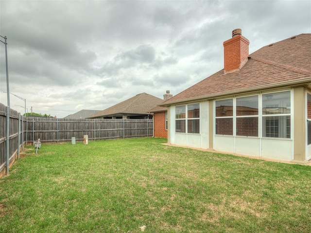 view of yard featuring a fenced backyard