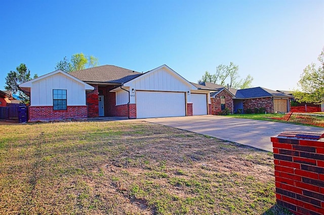 single story home featuring board and batten siding, an attached garage, and brick siding