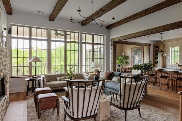 6509 NE 97th St, Oklahoma City, OK 73151 - sunroom / solarium featuring beam ceiling, french doors, and a chandelier