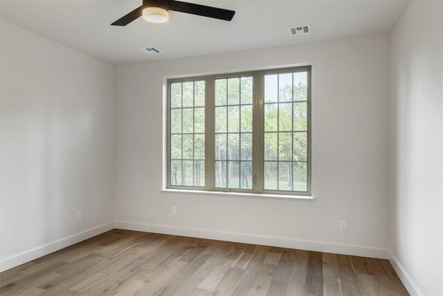 6509 NE 97th St, Oklahoma City, OK 73151 - empty room with light wood-style floors and a ceiling fan