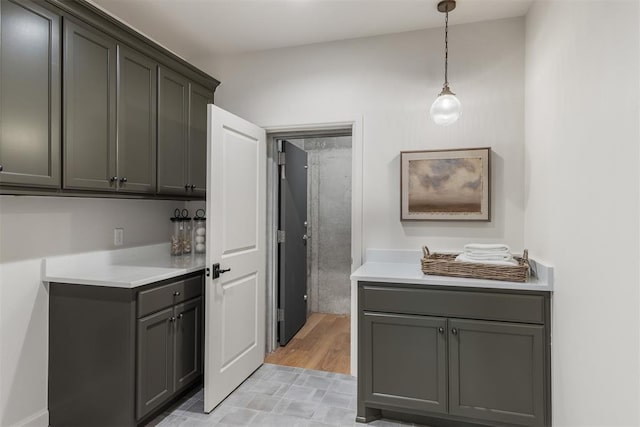 6509 NE 97th St, Oklahoma City, OK 73151 - kitchen featuring light countertops, pendant lighting, and gray cabinetry