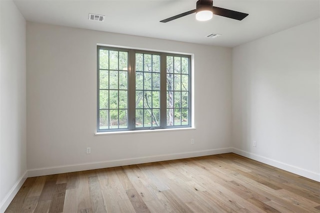 6509 NE 97th St, Oklahoma City, OK 73151 - spare room featuring plenty of natural light, light wood-style flooring, and ceiling fan
