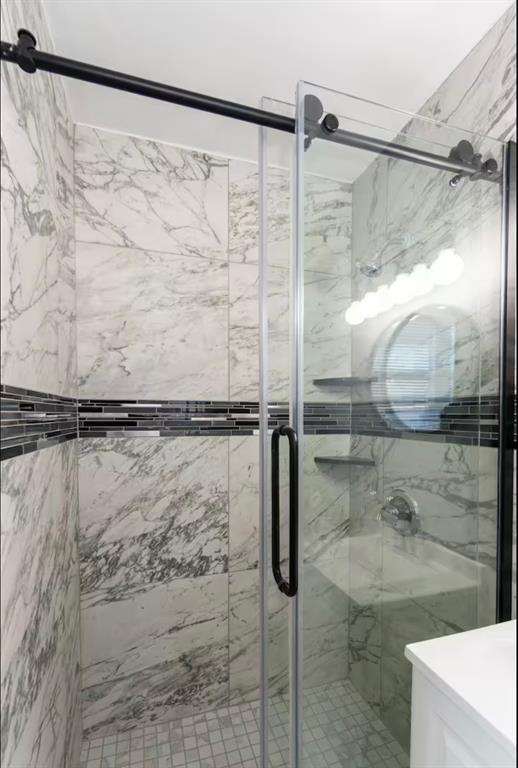 bathroom with a stall shower
