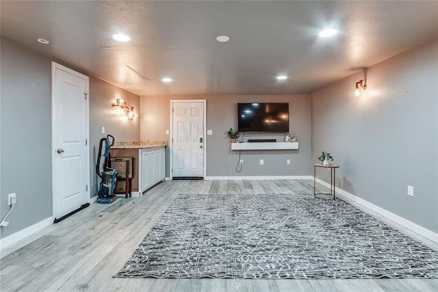 20318 State Highway 39, Purcell, OK 73080 - unfurnished living room featuring light wood-type flooring, recessed lighting, and baseboards