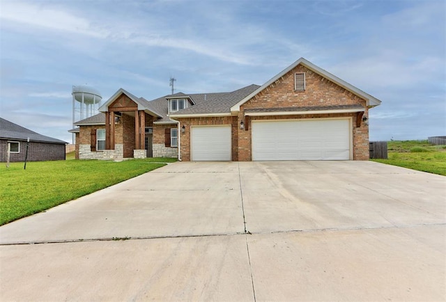 9600 Sultans Water Way, Yukon, OK 73099 - view of front of property featuring brick siding, a garage, a front lawn, concrete driveway, and roof with shingles