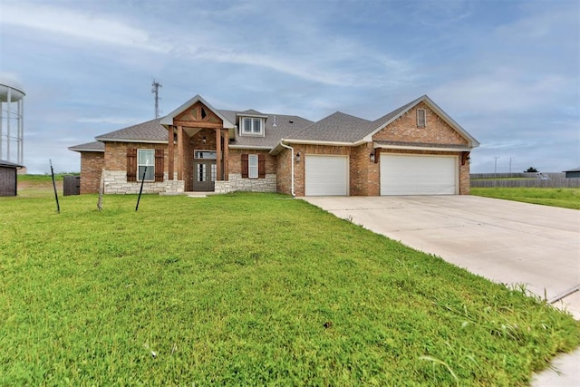 9600 Sultans Water Way, Yukon, OK 73099 - view of front of home featuring a garage, brick siding, concrete driveway, a front lawn, and roof with shingles