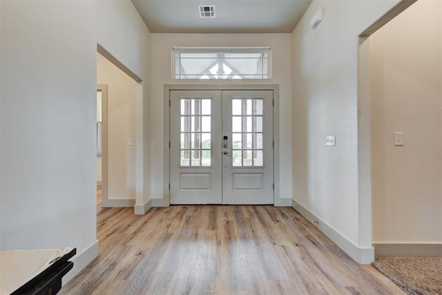 9600 Sultans Water Way, Yukon, OK 73099 - foyer featuring light wood-style flooring, french doors, and baseboards