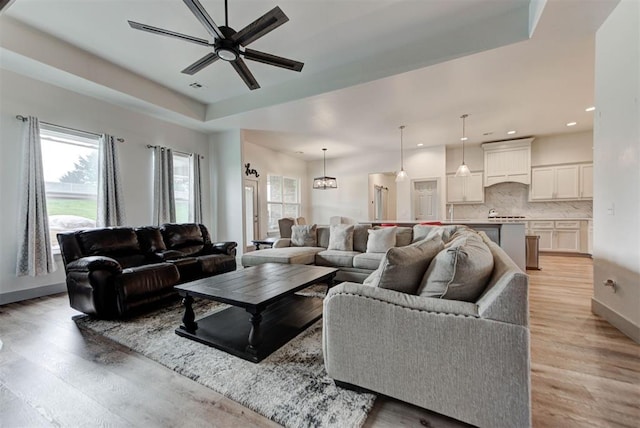9600 Sultans Water Way, Yukon, OK 73099 - living room featuring healthy amount of natural light, ceiling fan, light wood-style flooring, and recessed lighting