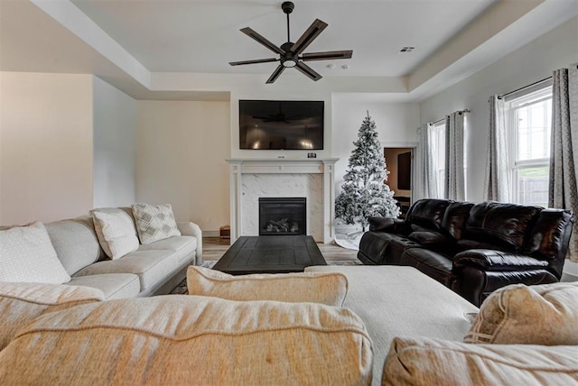 9600 Sultans Water Way, Yukon, OK 73099 - living room with wood finished floors, a ceiling fan, a premium fireplace, and baseboards