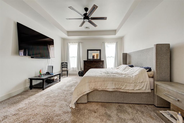 9600 Sultans Water Way, Yukon, OK 73099 - bedroom featuring a raised ceiling, carpet flooring, ceiling fan, and baseboards