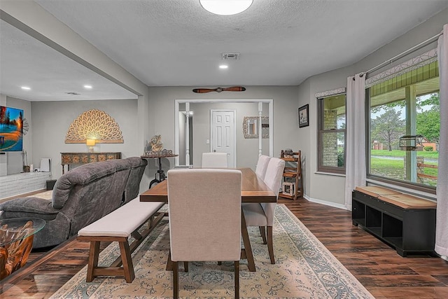 dining area with recessed lighting, baseboards, dark wood finished floors, and visible vents