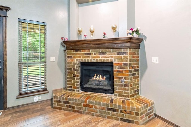 1904 Timber Xing, Yukon, OK 73099 - details with baseboards, wood finished floors, and a fireplace