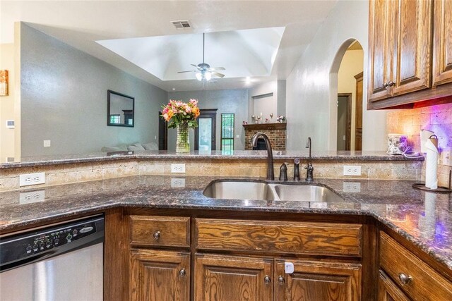 1904 Timber Xing, Yukon, OK 73099 - kitchen with a ceiling fan, visible vents, stainless steel dishwasher, a sink, and dark stone counters