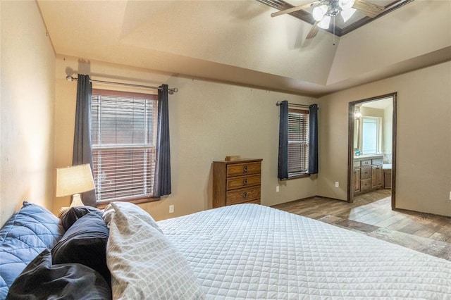 1904 Timber Xing, Yukon, OK 73099 - bedroom featuring ceiling fan, multiple windows, ensuite bathroom, and wood finished floors