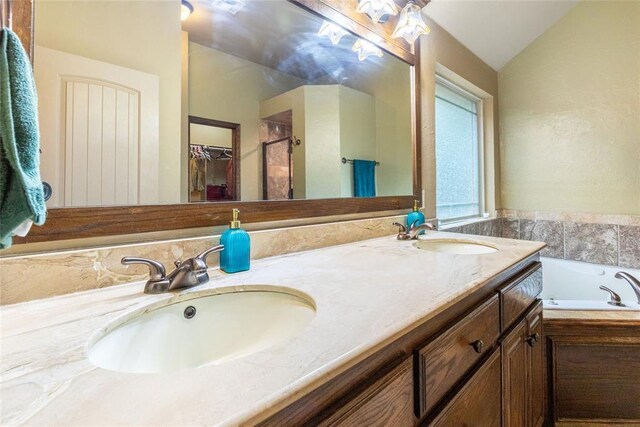 1904 Timber Xing, Yukon, OK 73099 - bathroom with double vanity, a sink, and a bath