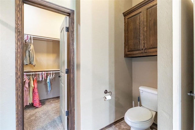 1904 Timber Xing, Yukon, OK 73099 - bathroom with a walk in closet and toilet