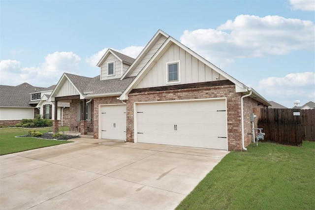 view of front of home with board and batten siding, brick siding, fence, a front lawn, and concrete driveway