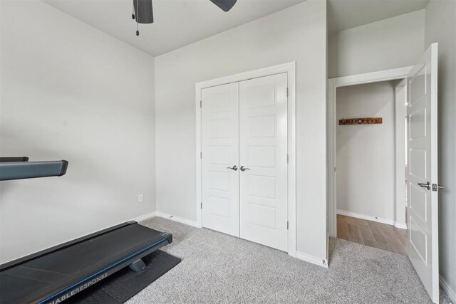 exercise area with carpet floors, baseboards, and ceiling fan