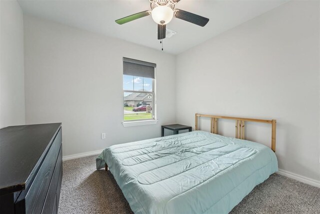 bedroom featuring carpet floors, baseboards, and ceiling fan