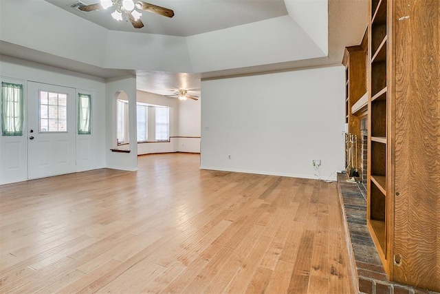 10601 Songbird Ln, Oklahoma City, OK 73130 - unfurnished living room with baseboards, a ceiling fan, and light wood-style flooring