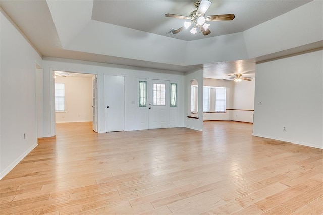 10601 Songbird Ln, Oklahoma City, OK 73130 - unfurnished living room with baseboards, a ceiling fan, and light wood finished floors