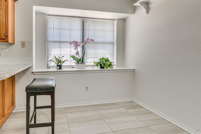 10601 Songbird Ln, Oklahoma City, OK 73130 - dining area with light tile patterned flooring and baseboards