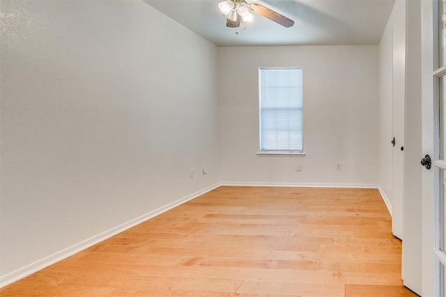 10601 Songbird Ln, Oklahoma City, OK 73130 - unfurnished room featuring light wood-style floors, baseboards, and ceiling fan